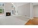 Large living room with a fireplace, big windows, and combination flooring at 1250 Parkview Nw Ln, Kennesaw, GA 30152