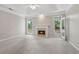 Inviting living room featuring neutral paint, plush carpet, a fireplace and a glass door leading outdoors at 1250 Parkview Nw Ln, Kennesaw, GA 30152