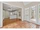 Open-concept sunroom with tile floors and views into kitchen and backyard at 1250 Parkview Nw Ln, Kennesaw, GA 30152
