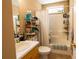 Functional bathroom with combined shower-tub and functional shelving for storage at 1312 Glenover Way, Marietta, GA 30062