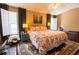 Well-lit bedroom with patterned bedding, large windows, and a stylish area rug at 1312 Glenover Way, Marietta, GA 30062