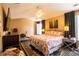 Inviting bedroom featuring patterned bedding, a dark dresser, and ample natural light at 1312 Glenover Way, Marietta, GA 30062