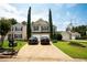 Charming two-story home with a well-manicured lawn, driveway, and beautiful landscaping, showcasing curb appeal at 1312 Glenover Way, Marietta, GA 30062