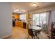 Well-lit eat-in kitchen with patio access, featuring updated appliances and tile floors for easy maintenance at 1312 Glenover Way, Marietta, GA 30062