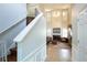 View of the spacious living room from the staircase, highlighting the high ceilings and natural light at 1312 Glenover Way, Marietta, GA 30062