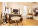 Open dining/living area featuring tile flooring, a stylish bar area, and a comfortable seating arrangement at 1312 Glenover Way, Marietta, GA 30062