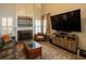 Open-concept living room with fireplace and media center providing a cozy and modern ambiance at 1312 Glenover Way, Marietta, GA 30062