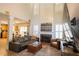 Inviting living room with soaring ceilings, fireplace, and ample natural light from large windows at 1312 Glenover Way, Marietta, GA 30062