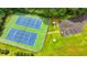Aerial view of community recreational area including tennis courts, playground, and basketball court at 1592 Walkway Ct, Lilburn, GA 30047