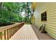 A home's wood deck overlooking a wooded area at 1592 Walkway Ct, Lilburn, GA 30047