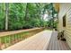A home's wood deck overlooking a wooded area at 1592 Walkway Ct, Lilburn, GA 30047