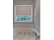 Close up of bathtub and window in bathroom at 1592 Walkway Ct, Lilburn, GA 30047