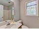 Well-lit bathroom with sink, and large mirror at 1592 Walkway Ct, Lilburn, GA 30047
