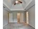 Spacious bedroom with plush carpet features a walk-in closet and access to the bathroom at 1592 Walkway Ct, Lilburn, GA 30047