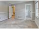 Bedroom showing access to hallway and adjacent bedroom at 1592 Walkway Ct, Lilburn, GA 30047
