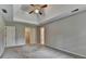 Bedroom with plush carpet features walk-in closet and adjacent bathroom at 1592 Walkway Ct, Lilburn, GA 30047