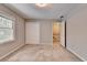 Bedroom with ample sunlight, closet, and staircase access at 1592 Walkway Ct, Lilburn, GA 30047