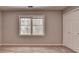Bedroom featuring a large window and closet at 1592 Walkway Ct, Lilburn, GA 30047