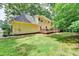 Exterior of a home with a spacious backyard at 1592 Walkway Ct, Lilburn, GA 30047