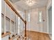 Welcoming foyer with hardwood floors and staircase at 1592 Walkway Ct, Lilburn, GA 30047