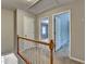 A neutrally decorated hallway with open doorways and closed doors, located on the second level at 1592 Walkway Ct, Lilburn, GA 30047