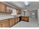 Kitchen featuring wooden cabinets and ample countertop space at 1592 Walkway Ct, Lilburn, GA 30047