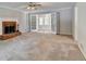 Spacious living room featuring a fireplace and view to sun room at 1592 Walkway Ct, Lilburn, GA 30047