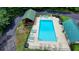 Community pool with ample seating, offering residents a relaxing and enjoyable outdoor experience at 1592 Walkway Ct, Lilburn, GA 30047