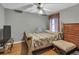 Bedroom with hardwood floors, neutral walls, and a decorative ceiling fan at 4969 Truitt Ln, Decatur, GA 30035