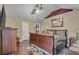 Bedroom featuring hardwood floors, a ceiling fan, and a walk in closet at 4969 Truitt Ln, Decatur, GA 30035