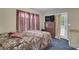 This bedroom features carpet floors, a dresser, and a sliding glass door at 4969 Truitt Ln, Decatur, GA 30035