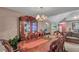 Formal dining room with elegant chandelier, china cabinet and seating for eight people at 4969 Truitt Ln, Decatur, GA 30035