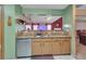 Kitchen area with granite countertops, wooden cabinets, and a view into the dining area at 4969 Truitt Ln, Decatur, GA 30035