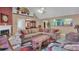 Open concept living room featuring a fireplace, vaulted ceilings, and access to dining and kitchen at 4969 Truitt Ln, Decatur, GA 30035