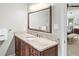 Bathroom featuring a granite vanity, large mirror and a view into the bedroom area at 100 Parkerwood Way, Alpharetta, GA 30022