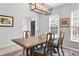 Bright dining room with large table and natural light at 100 Parkerwood Way, Alpharetta, GA 30022
