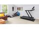 Home gym with exercise equipment including treadmill, weights, and exercise bench at 100 Parkerwood Way, Alpharetta, GA 30022