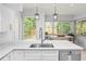 Bright kitchen with modern fixtures and countertops at 100 Parkerwood Way, Alpharetta, GA 30022