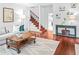 Welcoming living room with hardwood floors, comfortable seating, and stylish decor at 100 Parkerwood Way, Alpharetta, GA 30022