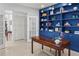 Office with built in shelves and decorative french doors at 100 Parkerwood Way, Alpharetta, GA 30022