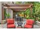 Inviting outdoor patio with pergola, grill, stone accents, and comfortable seating is great for gatherings at 100 Parkerwood Way, Alpharetta, GA 30022