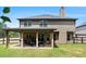 Backyard with covered patio, outdoor furniture, and privacy fence at 10044 Cormac St, Jonesboro, GA 30238