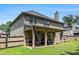 Backyard featuring a covered patio, well-kept lawn, and privacy fence at 10044 Cormac St, Jonesboro, GA 30238