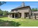This home features a backyard and covered patio at 10044 Cormac St, Jonesboro, GA 30238