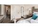 Bedroom with doors, bedside table, and view of the hallway at 10044 Cormac St, Jonesboro, GA 30238