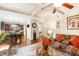 Open-concept living area flowing into the kitchen with hardwood floors and comfortable furnishings at 10044 Cormac St, Jonesboro, GA 30238