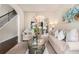 Comfortable living room with neutral décor, arched doorways, and a glimpse into the dining area at 10044 Cormac St, Jonesboro, GA 30238