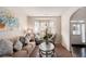 Cozy living room featuring a bay window, plush seating, neutral tones, and an inviting atmosphere at 10044 Cormac St, Jonesboro, GA 30238
