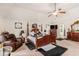 Spacious primary bedroom with a sitting area, vaulted ceilings and decorative wall art at 10044 Cormac St, Jonesboro, GA 30238