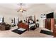 Large main bedroom with tray ceiling, sitting area and plenty of natural light at 10044 Cormac St, Jonesboro, GA 30238